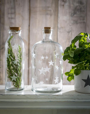 Large narrow neck glass storage jar … Star