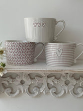 Load image into Gallery viewer, Red outline full heart pattern mug