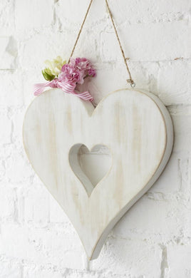 Carved white heart in heart decoration