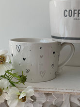 Load image into Gallery viewer, Natural &amp; black Heart scatter Mug