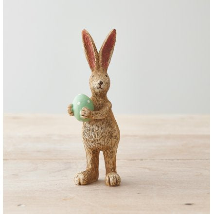 Standing resin rabbit … green egg