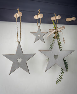 Hanging stars with carved heart detail ... grey