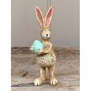 Standing resin rabbit … green egg